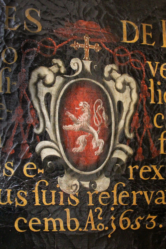 Wappen mit Löwen mit einem Brezelschweif